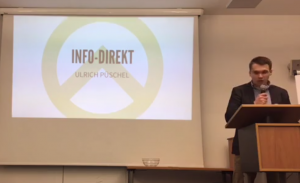 Präsentation von INFO-DIREKT. Rechts: Michael Scharfmüller. (Screenshot der FB-Liveübertragung des Kongresses)
